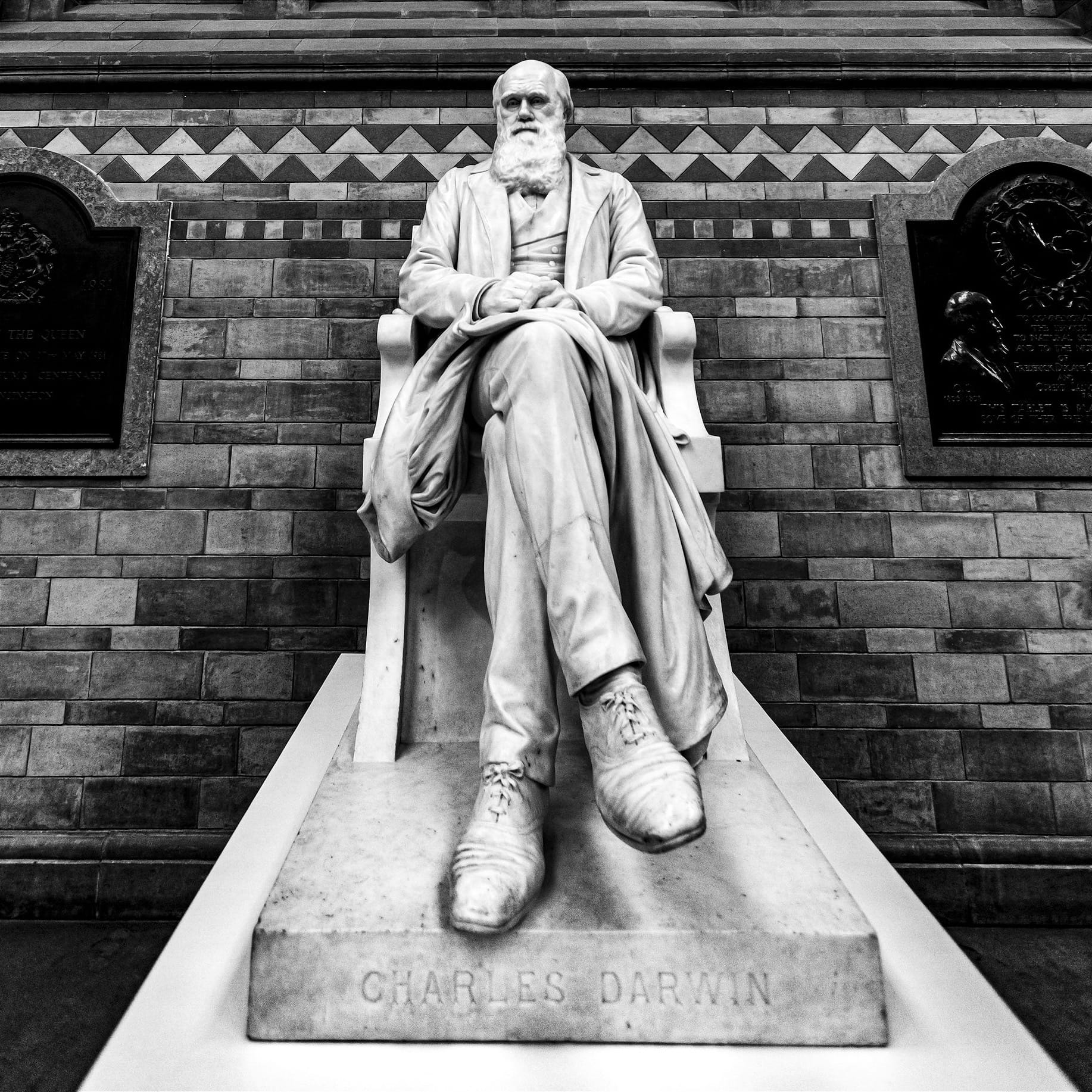 white concrete statue of a man